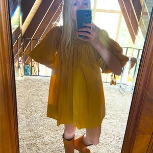 Doen mini dress with beautiful full sleeves, embroidery detail and cuff ties.